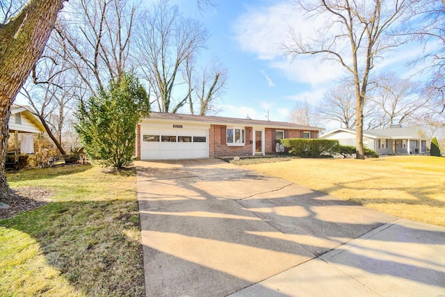 ranch-style home featuring a garage, driveway, brick siding, and a front lawn