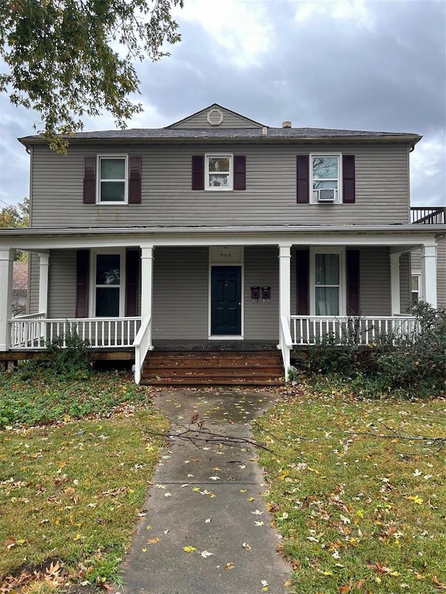 view of front of house featuring a porch and a front lawn