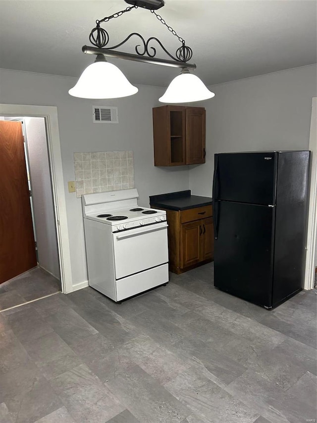 kitchen with visible vents, freestanding refrigerator, open shelves, white range with electric cooktop, and dark countertops