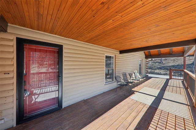 wooden terrace with a porch