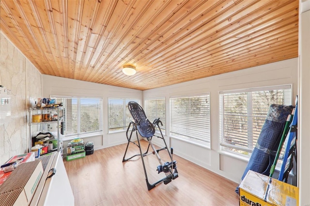 exercise area with wooden ceiling and wood finished floors