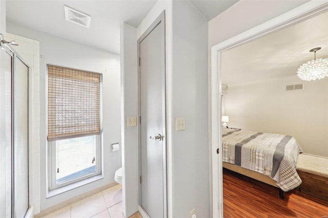 bedroom featuring visible vents and light tile patterned flooring