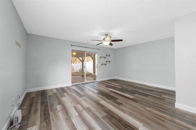 interior space with ceiling fan, baseboards, and wood finished floors