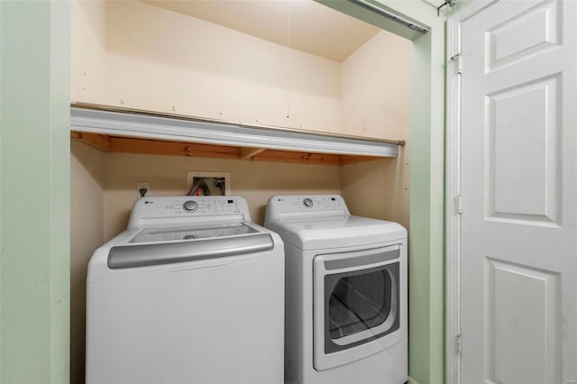 washroom with laundry area and washing machine and clothes dryer