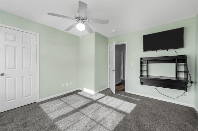 unfurnished bedroom featuring baseboards, carpet floors, and ceiling fan