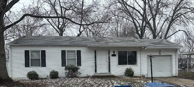 single story home featuring driveway and an attached garage