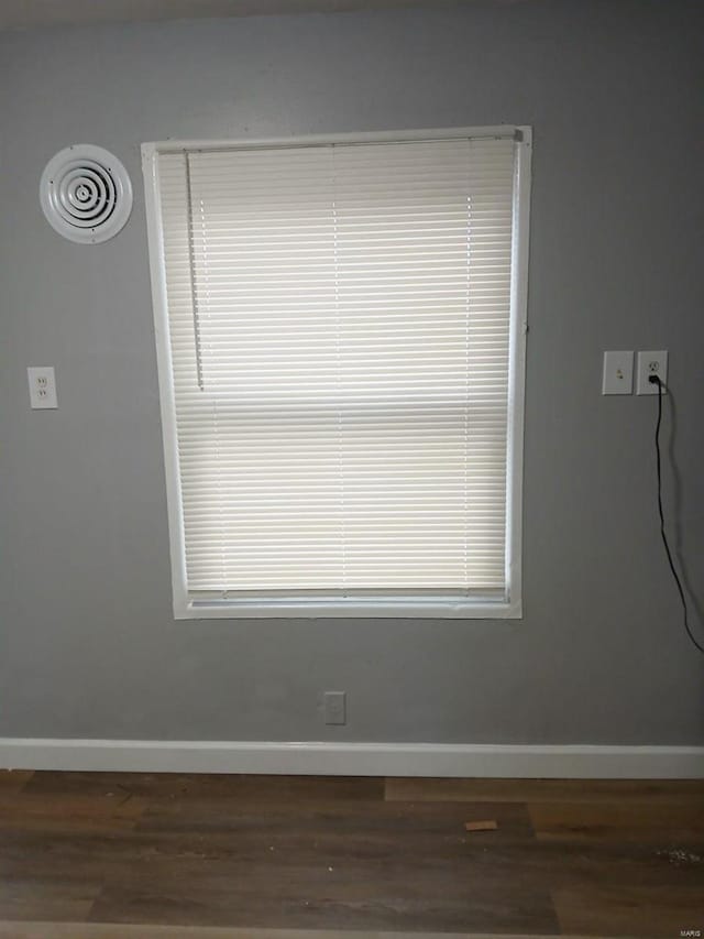 details with baseboards and wood finished floors
