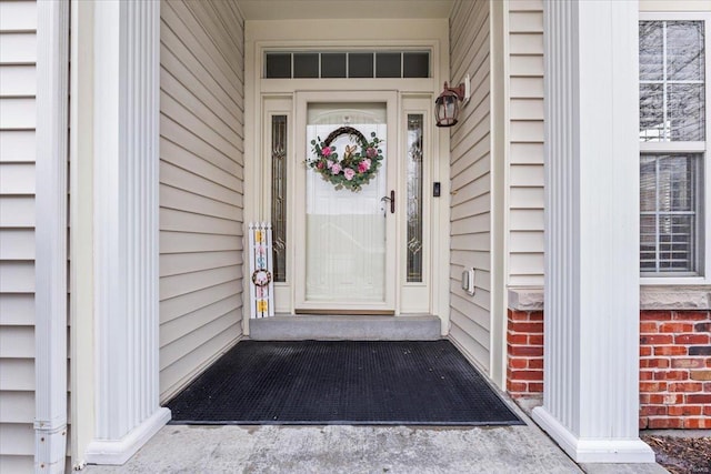 entrance to property with brick siding