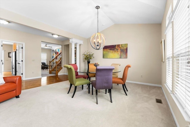 dining area with a wealth of natural light, light carpet, and visible vents