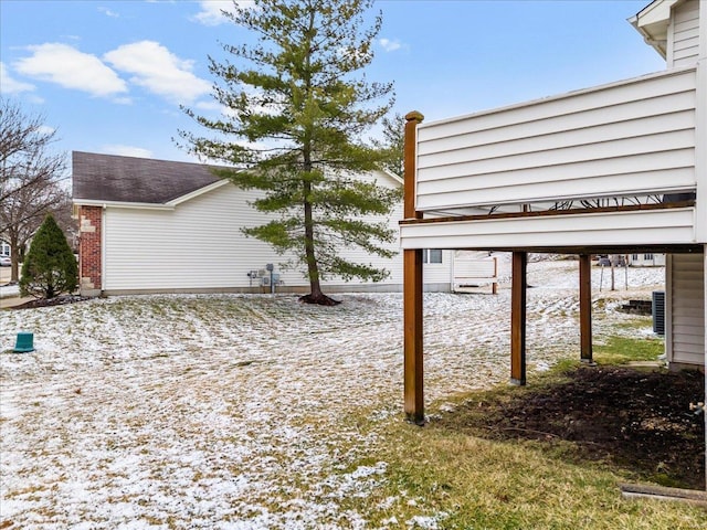 view of side of home featuring brick siding