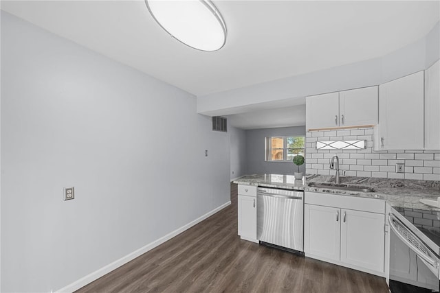 kitchen featuring baseboards, range with electric cooktop, a sink, dishwasher, and backsplash