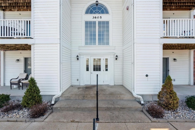 entrance to property featuring a balcony