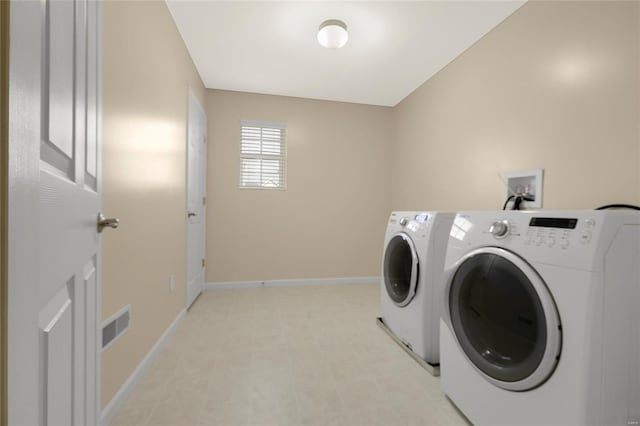 laundry area with baseboards, laundry area, independent washer and dryer, and visible vents