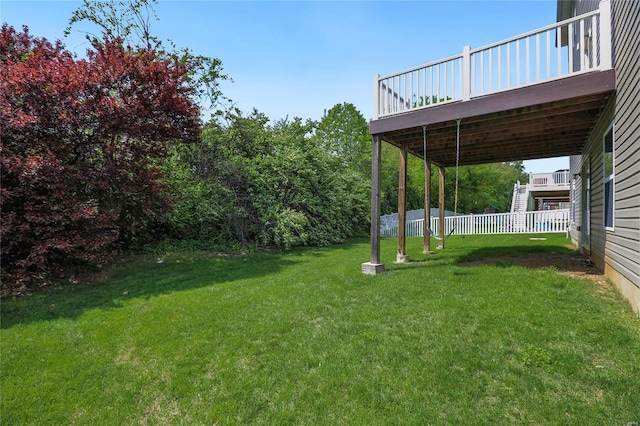 view of yard featuring a deck and fence
