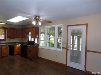 kitchen featuring dishwasher, baseboards, brown cabinets, and dark wood-style flooring