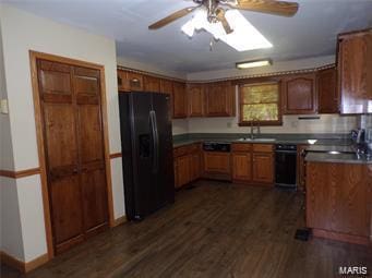 kitchen featuring ceiling fan, dark wood-type flooring, a sink, black fridge with ice dispenser, and brown cabinets