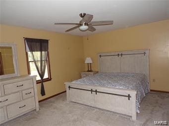 unfurnished bedroom with light carpet, baseboards, and a ceiling fan