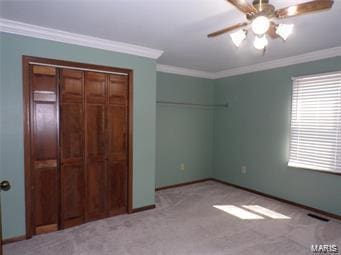 unfurnished bedroom with carpet, ornamental molding, and baseboards