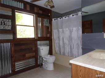 full bath with a ceiling fan, radiator, toilet, shower / bathtub combination with curtain, and vanity