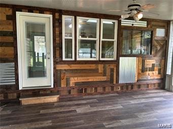 entrance to property featuring ceiling fan