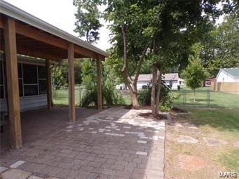 view of patio featuring fence