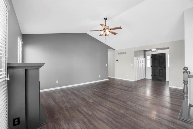 unfurnished living room with lofted ceiling, baseboards, dark wood-type flooring, and a ceiling fan