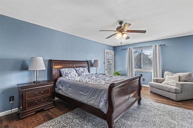 bedroom with ceiling fan, baseboards, and wood finished floors