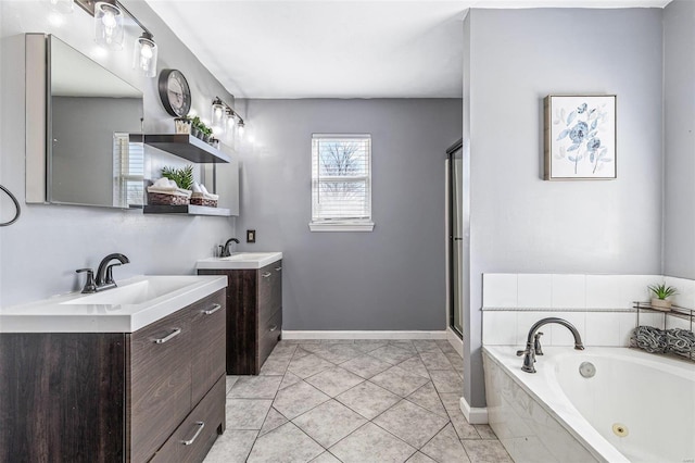 full bath with tile patterned floors, a stall shower, two vanities, and a sink