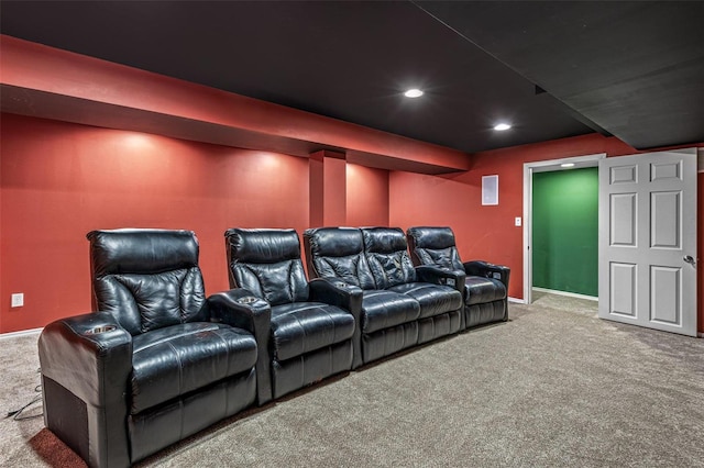 carpeted home theater room with recessed lighting and baseboards