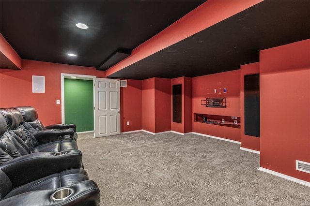 carpeted home theater room featuring visible vents, recessed lighting, and baseboards