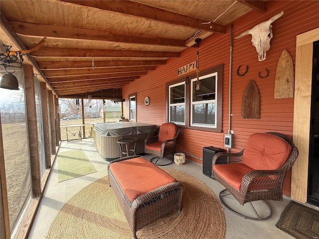 view of patio / terrace with a hot tub