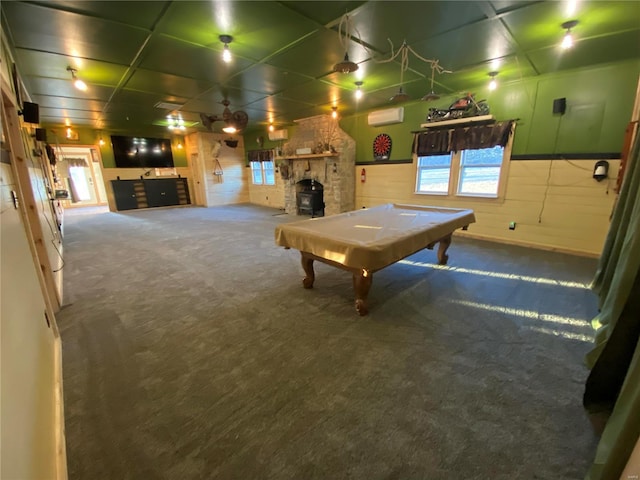 playroom featuring a stone fireplace, a wainscoted wall, carpet floors, billiards, and an AC wall unit