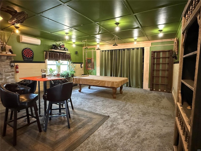 game room with carpet floors, a wainscoted wall, and a wall mounted AC