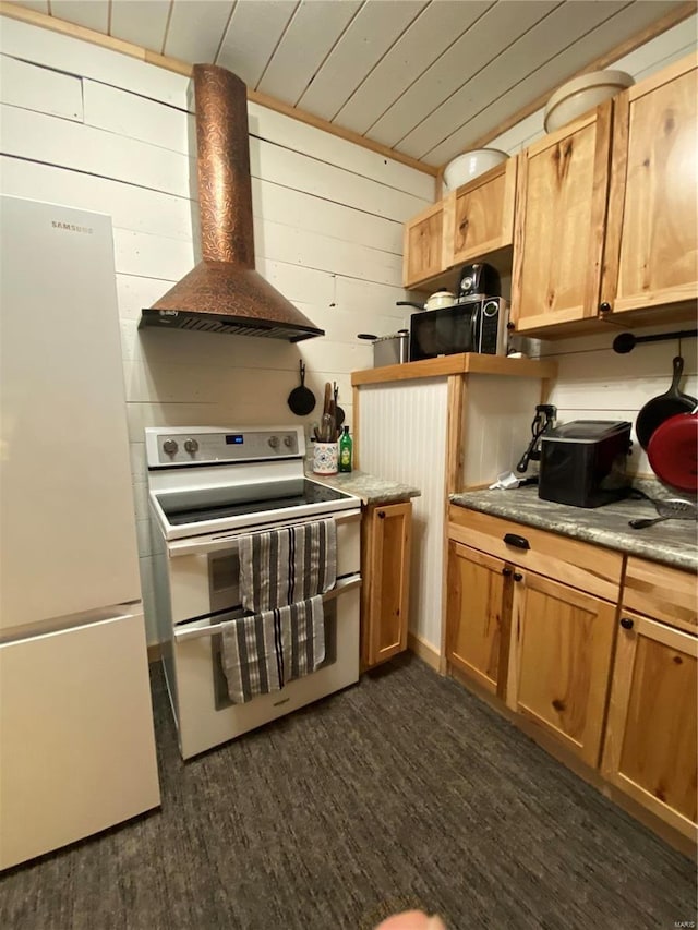 kitchen featuring wooden ceiling, dark wood-type flooring, white appliances, wood walls, and wall chimney range hood