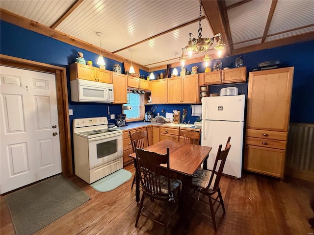 kitchen featuring dark wood-style floors, white appliances, light countertops, and hanging light fixtures