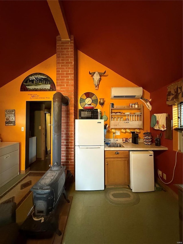 interior space with washer / dryer, refrigerator, freestanding refrigerator, an AC wall unit, and black microwave