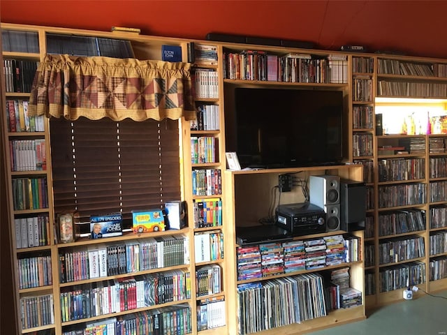 sitting room featuring bookshelves