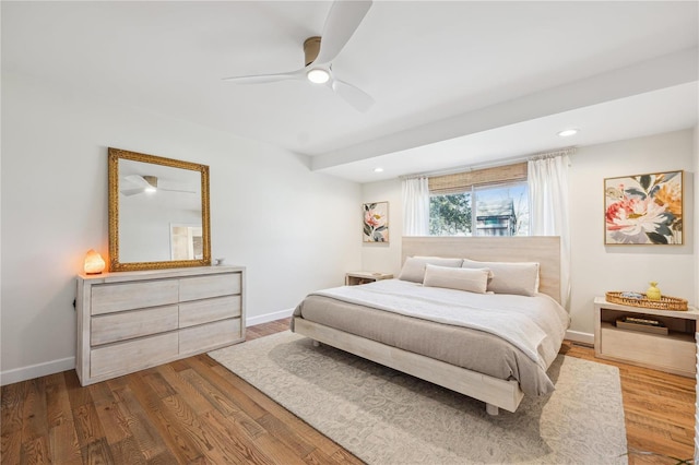 bedroom with recessed lighting, wood finished floors, baseboards, and ceiling fan