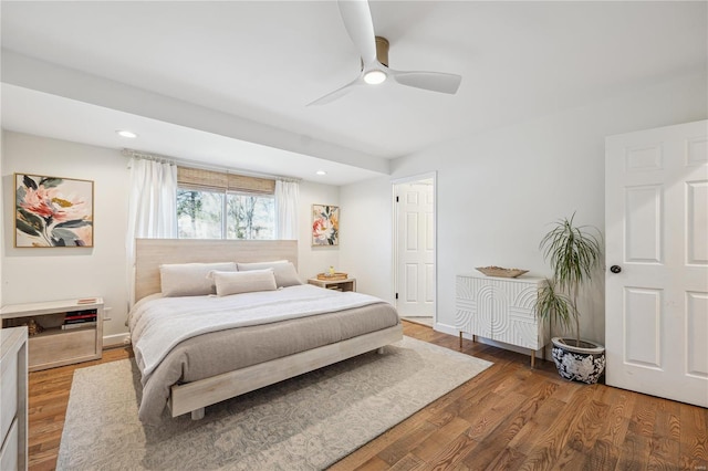 bedroom with recessed lighting, baseboards, and wood finished floors