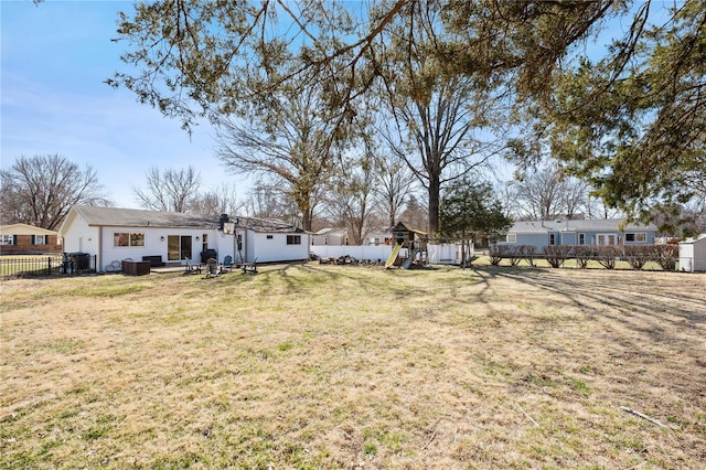 view of yard with a playground and a fenced backyard