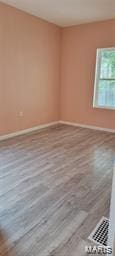 spare room featuring baseboards