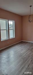 spare room featuring baseboards