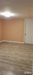 empty room featuring baseboards