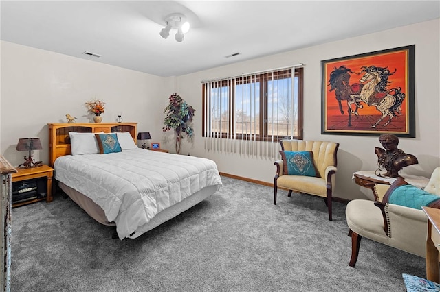 bedroom featuring visible vents, baseboards, and carpet floors