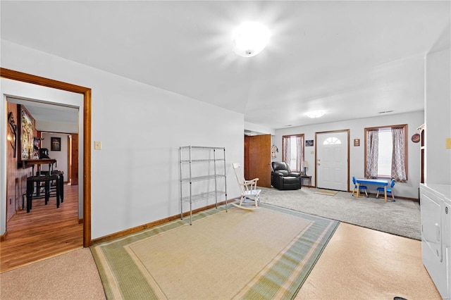 interior space with washing machine and dryer and baseboards