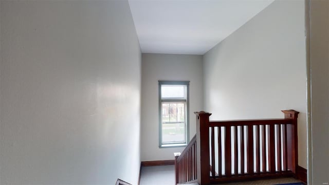 stairway featuring baseboards