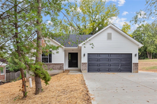 view of front facade with driveway, brick siding, an attached garage, and a shingled roof