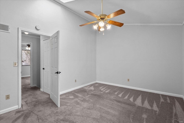 unfurnished bedroom with carpet, visible vents, baseboards, and ornamental molding