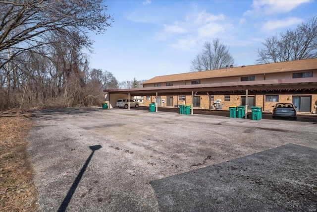 view of community featuring uncovered parking