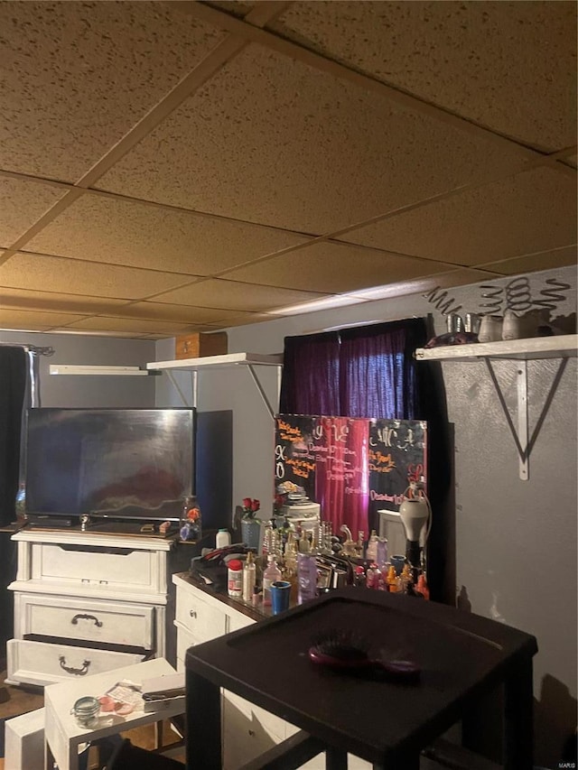 game room featuring a drop ceiling